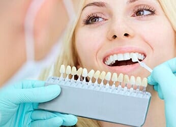 Woman Having an Implant Dentures — Dunnellon, FL — Carolina Dentures and General Dentistry