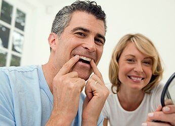 Man Showing His Clean Teeth — Dunnellon, FL — Carolina Dentures and General Dentistry