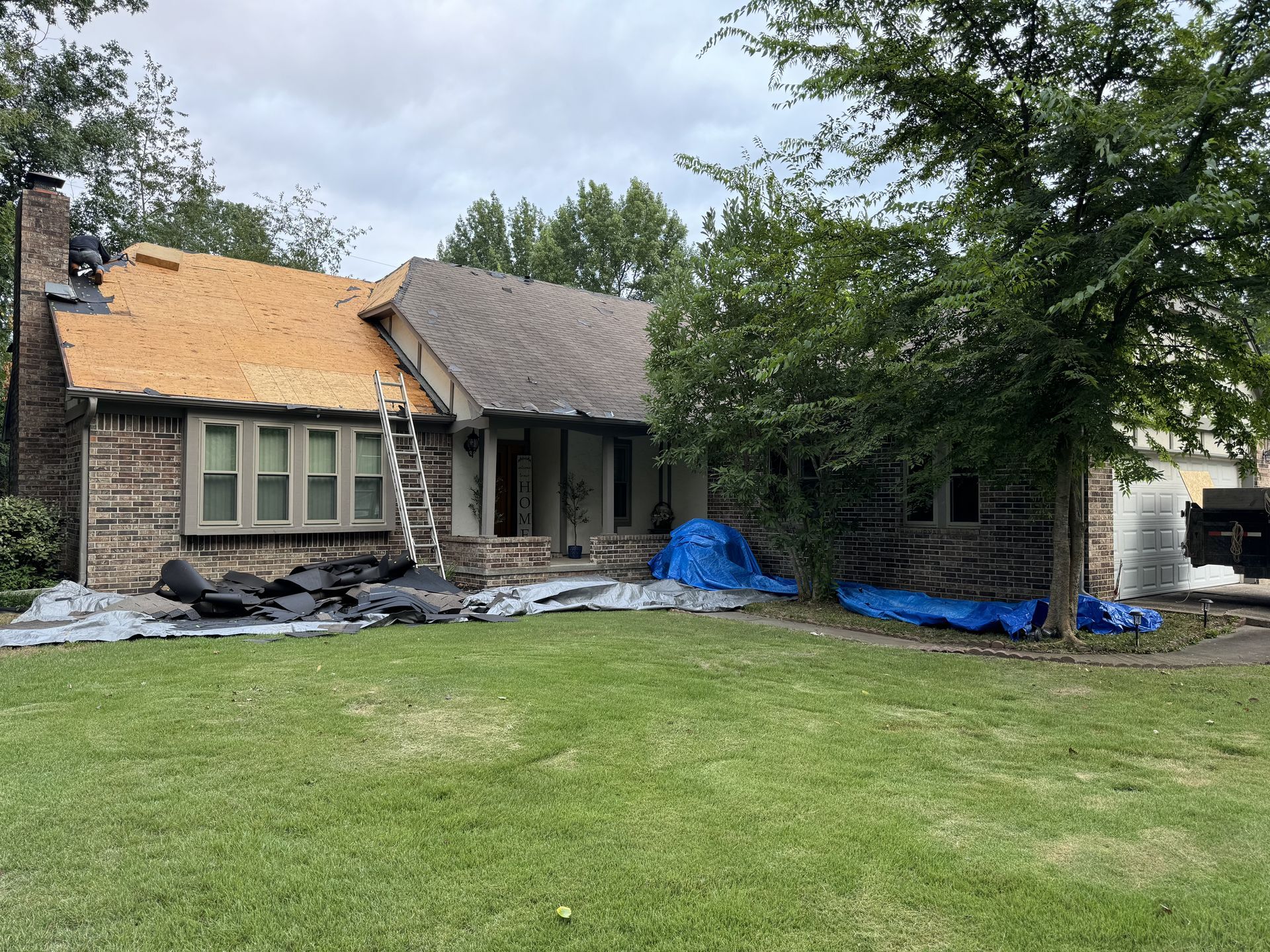 A house is being remodeled with a new roof.