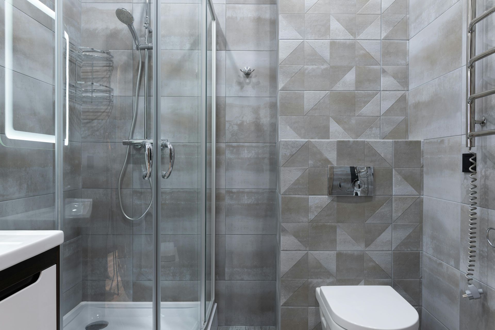 grey tile walls and modern fixtures