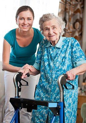 Assisted Living Community — Nursing Home Resident with Nurse in Central City, NE