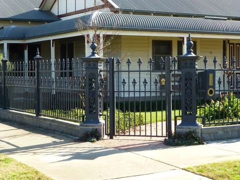 house with iron fence