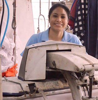 Beautiful lady worker smiling — Clothesline in Highwood IL