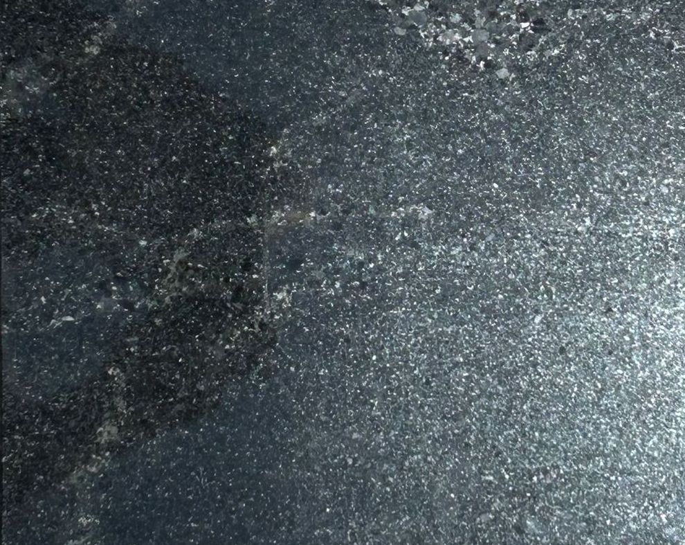 A black tile with a green star on it