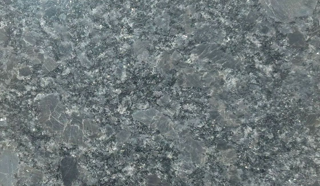 A piece of black granite with a label that says leather