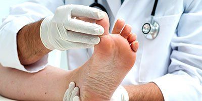 Podiatrist Checking Foot - Podiatry Treatment in Rego Park, NY