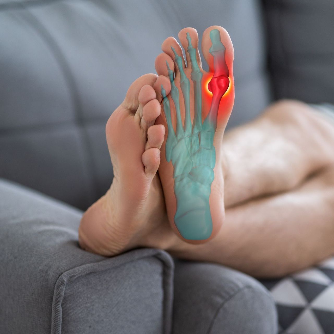 A close up of a person 's foot with a red toe.