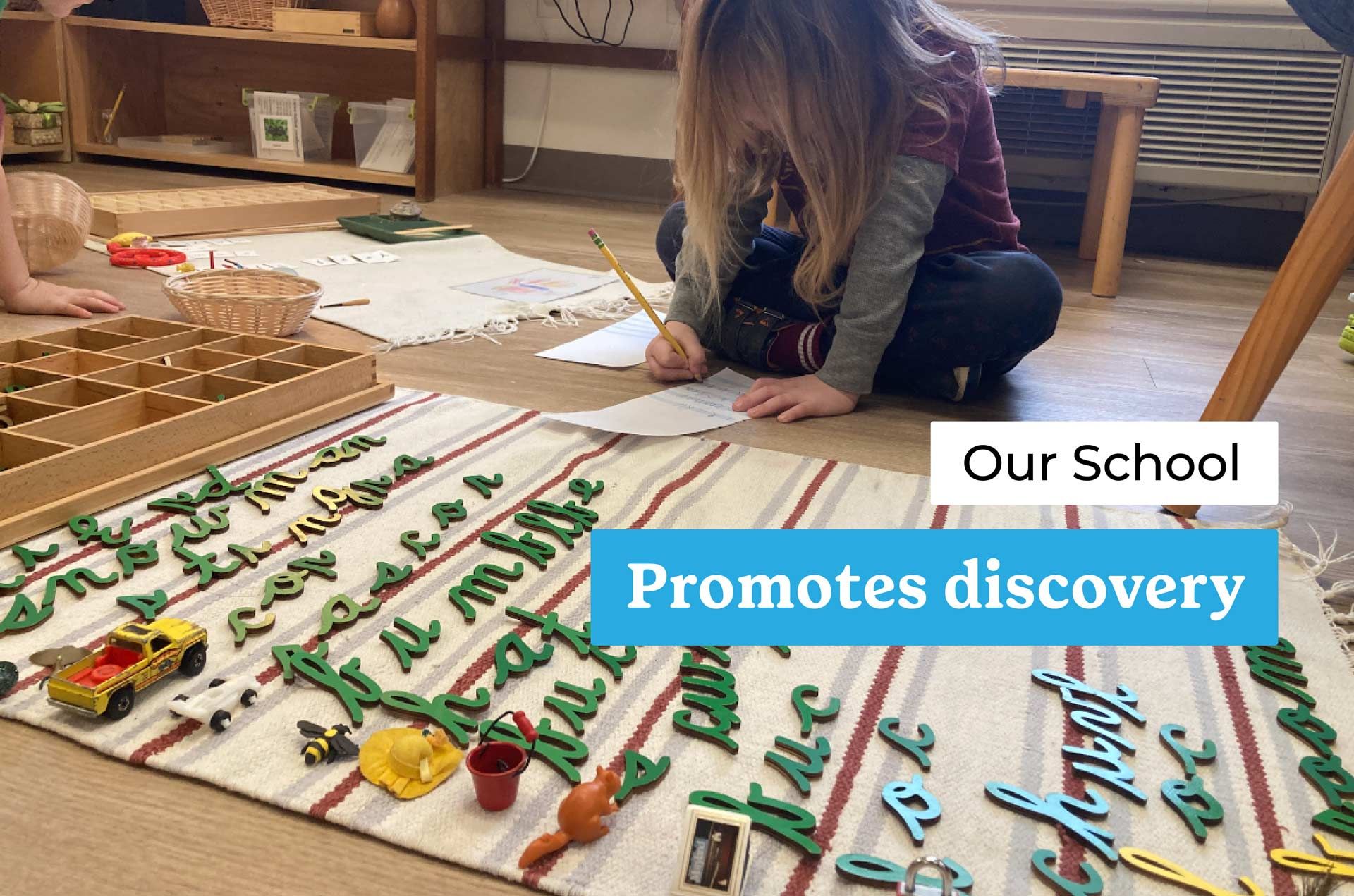 montessori child writing with movable alphabet and objects on rug