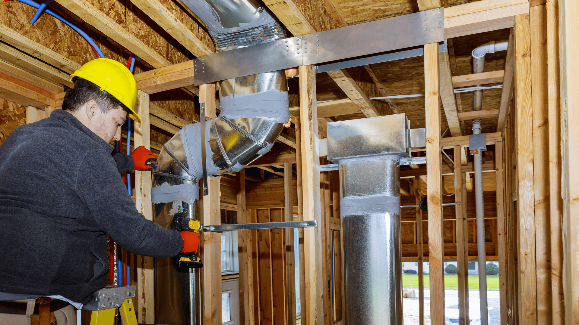 man repairing duct