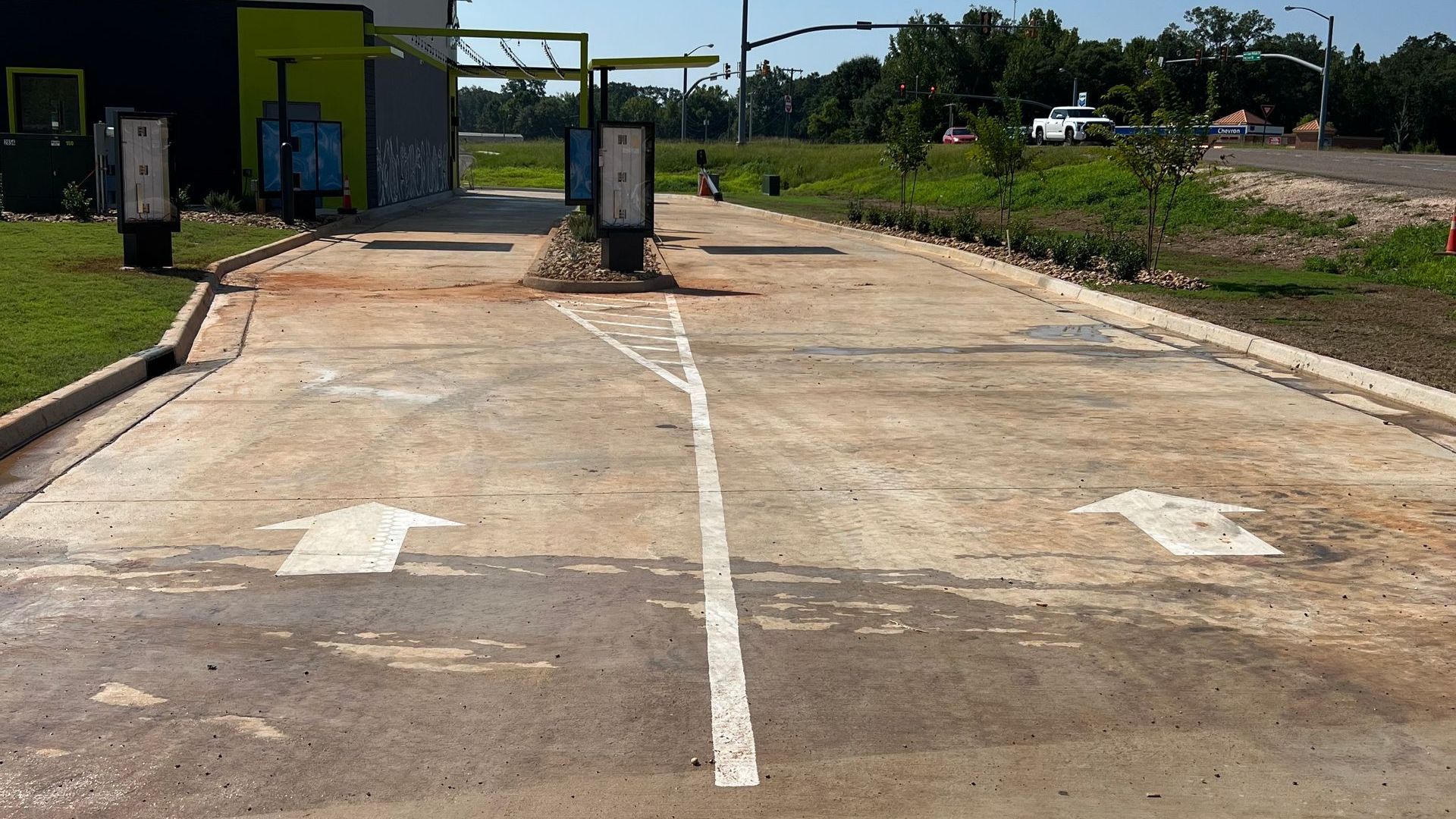 A parking lot with arrows pointing in opposite directions