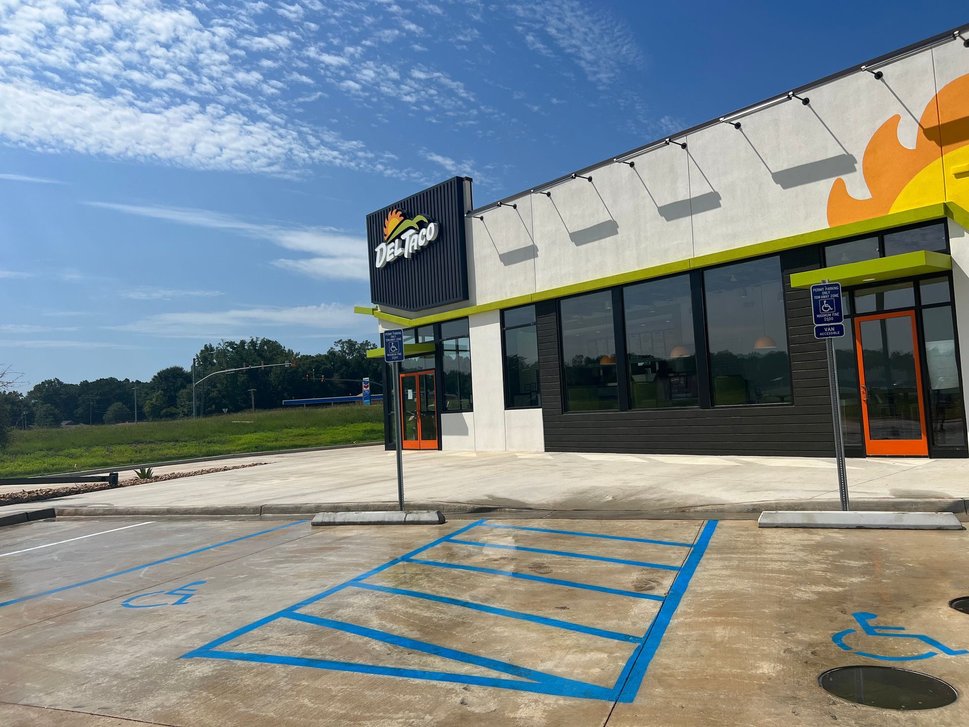 A large building with a handicapped parking spot in front of it.