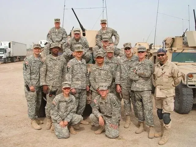 A group of soldiers are posing for a picture