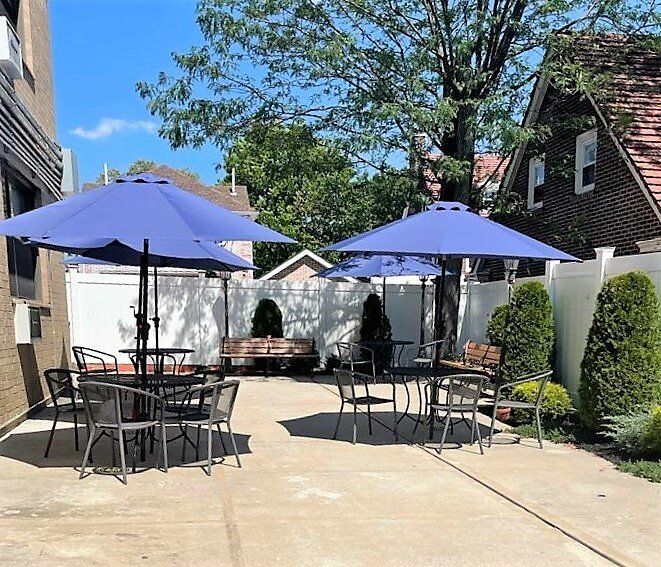 Man elderly reading a newspaper.