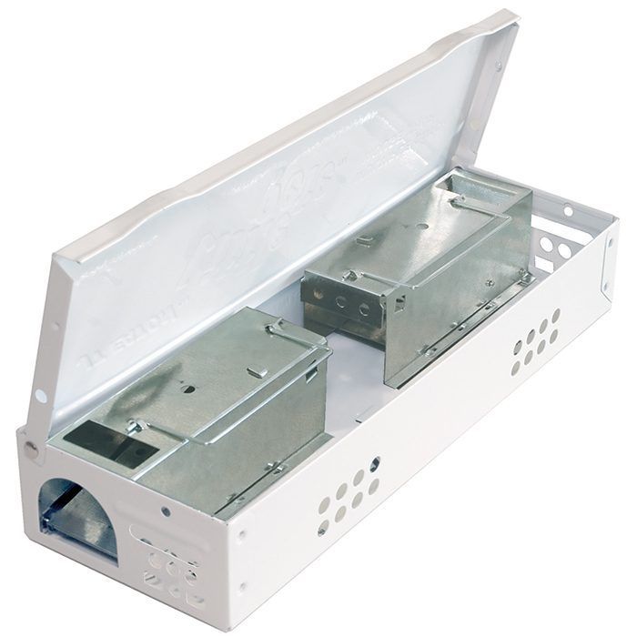 A white box with two metal boxes inside of it