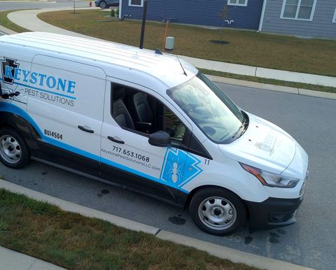 keystone pest solutions LLC service van white and blue