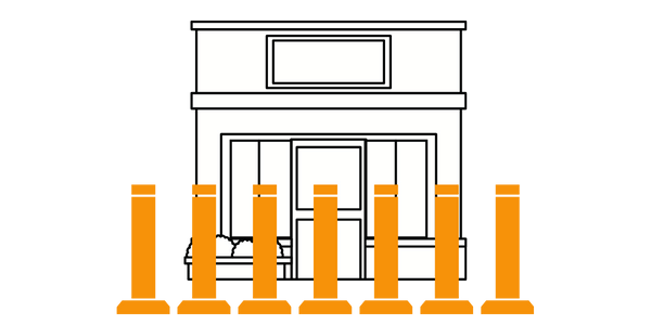 A drawing of a store with orange bollards in front of it.