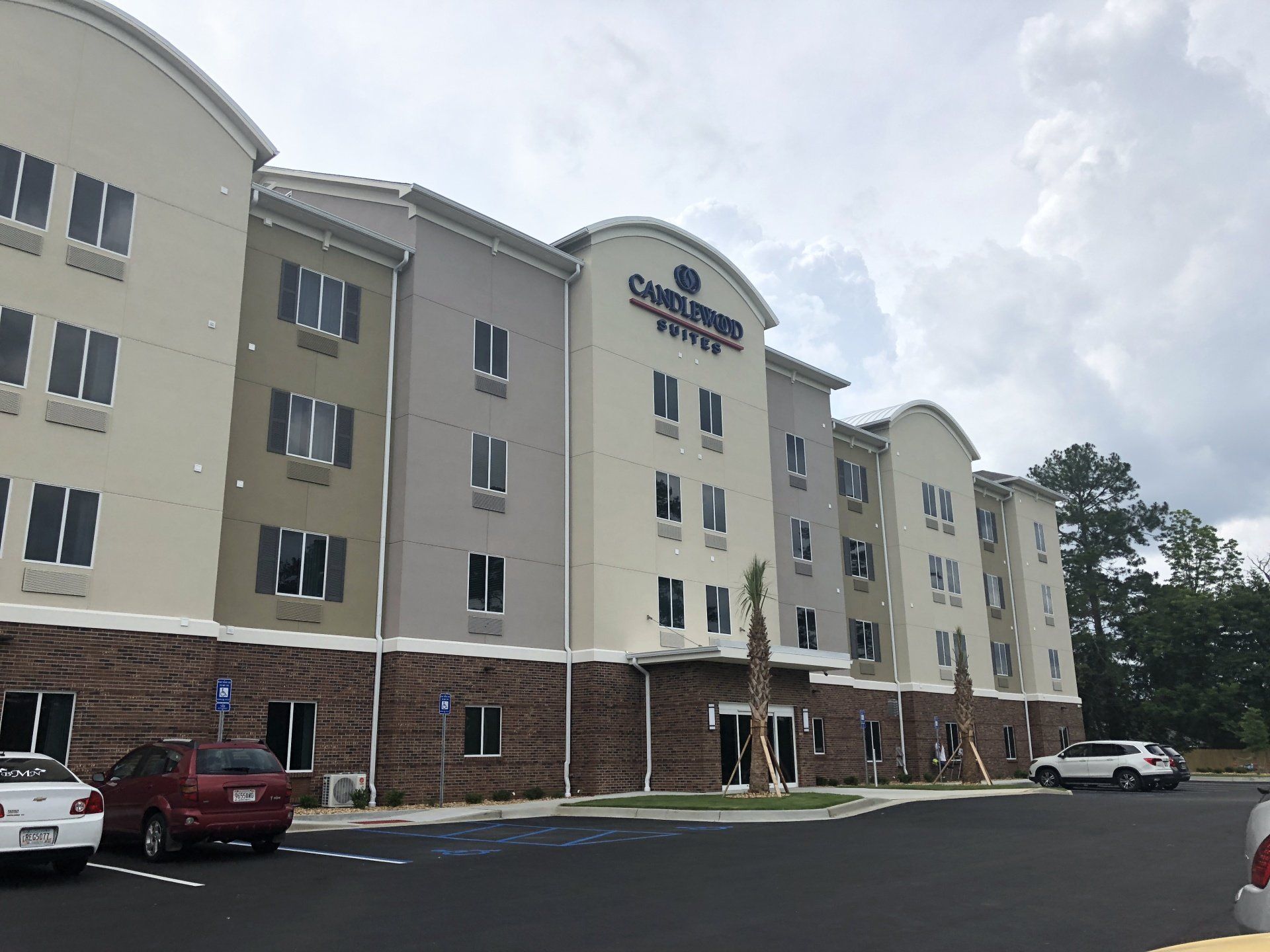 Exterior and parking lot of the Candlewood Suites in Valdosta, GA.