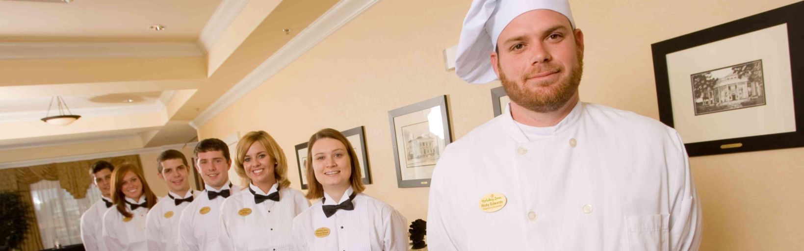 A chef with staff at the Holiday Inn and Conference Center in Valdosta, GA.