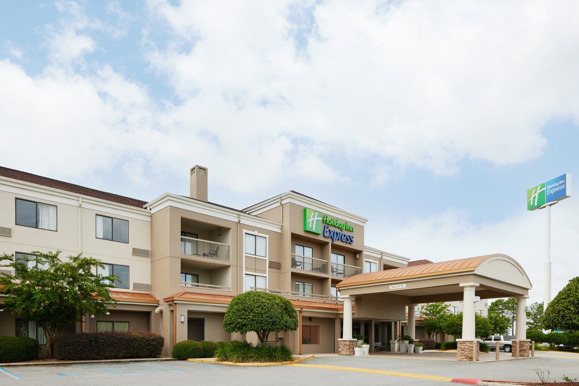 Exterior with porches at the Holiday Inn Express in Tifton, GA.
