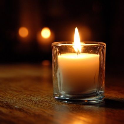Glass memorial candle creates warm remembrance setting for families in Bedford Park, IL.