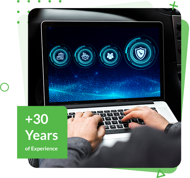 A person is typing on a laptop with a sign that says +30 years of experience