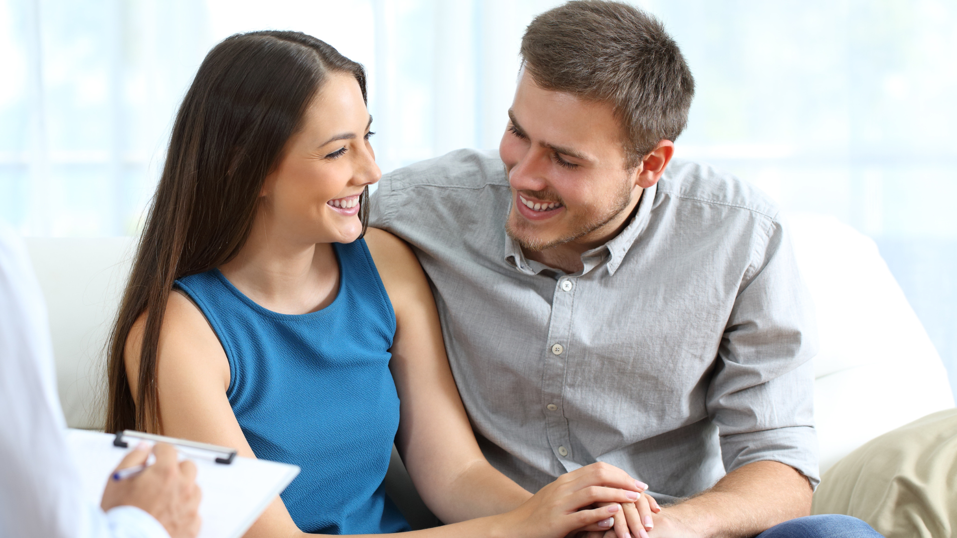 a close up of a person holding another person 's hand