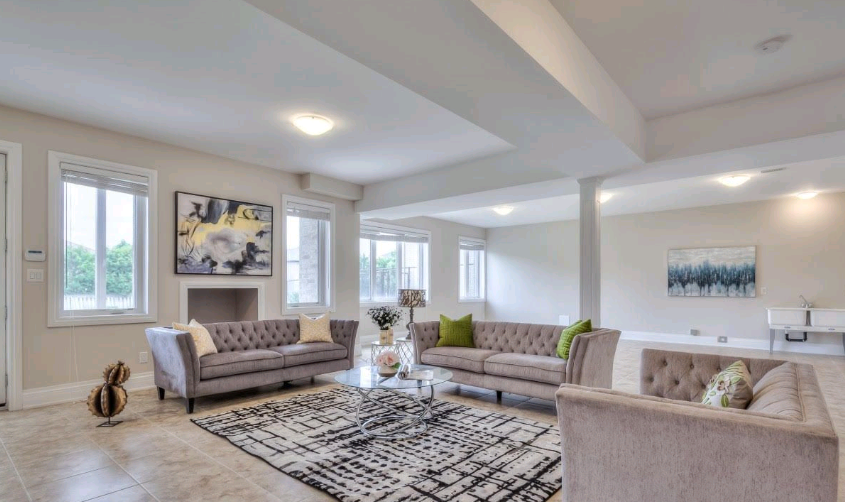 A living room filled with furniture and a fireplace.