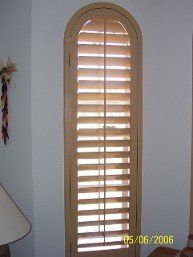 There is a picture of a door with shutters on it.