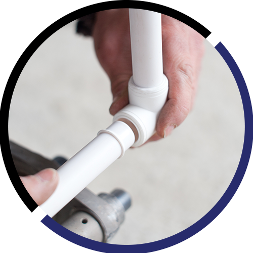 A person is holding a white pipe in their hands