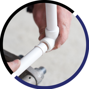 A person is holding a white pipe in their hands