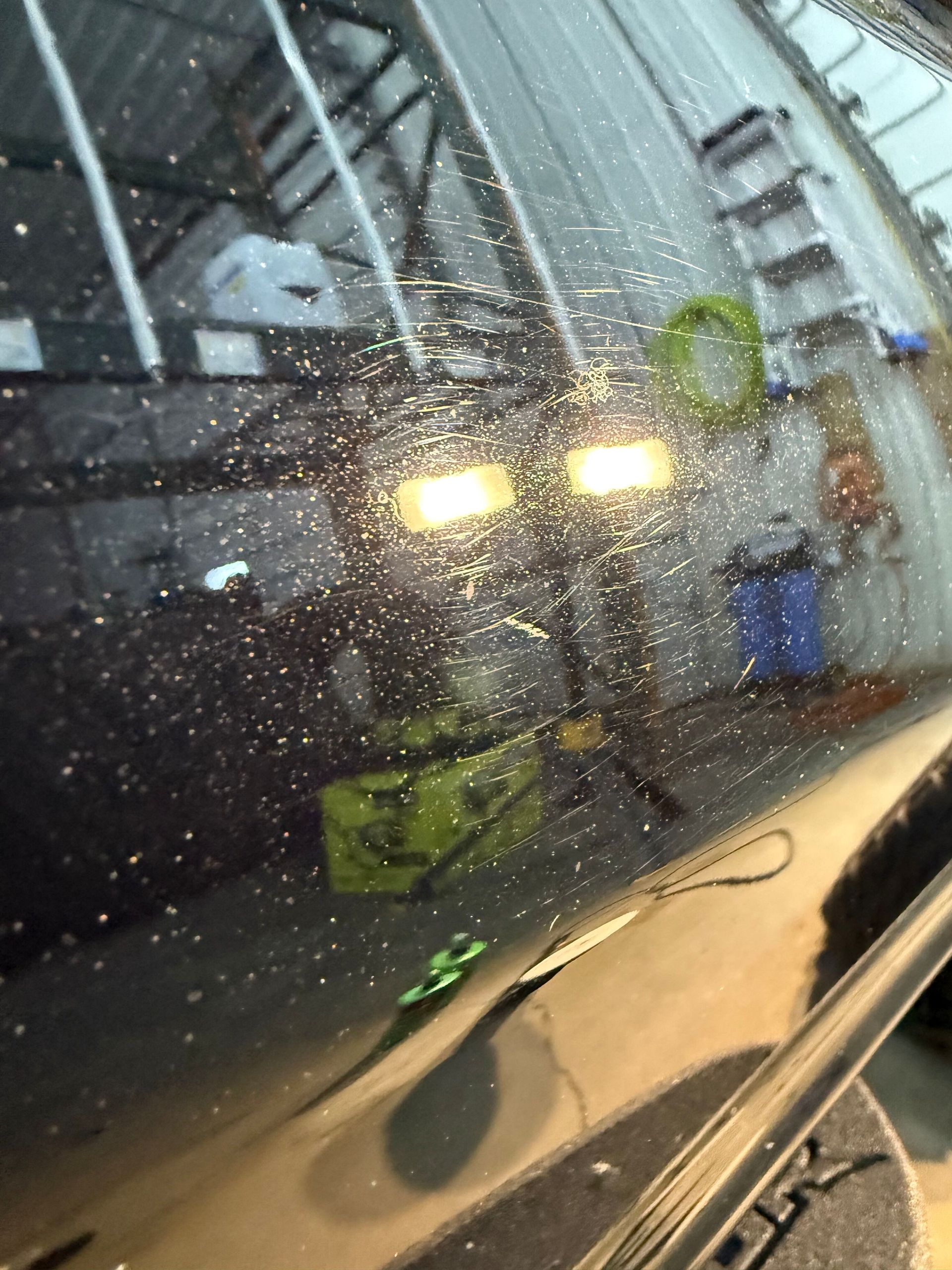A close up of a car windshield with a lot of dust on it.