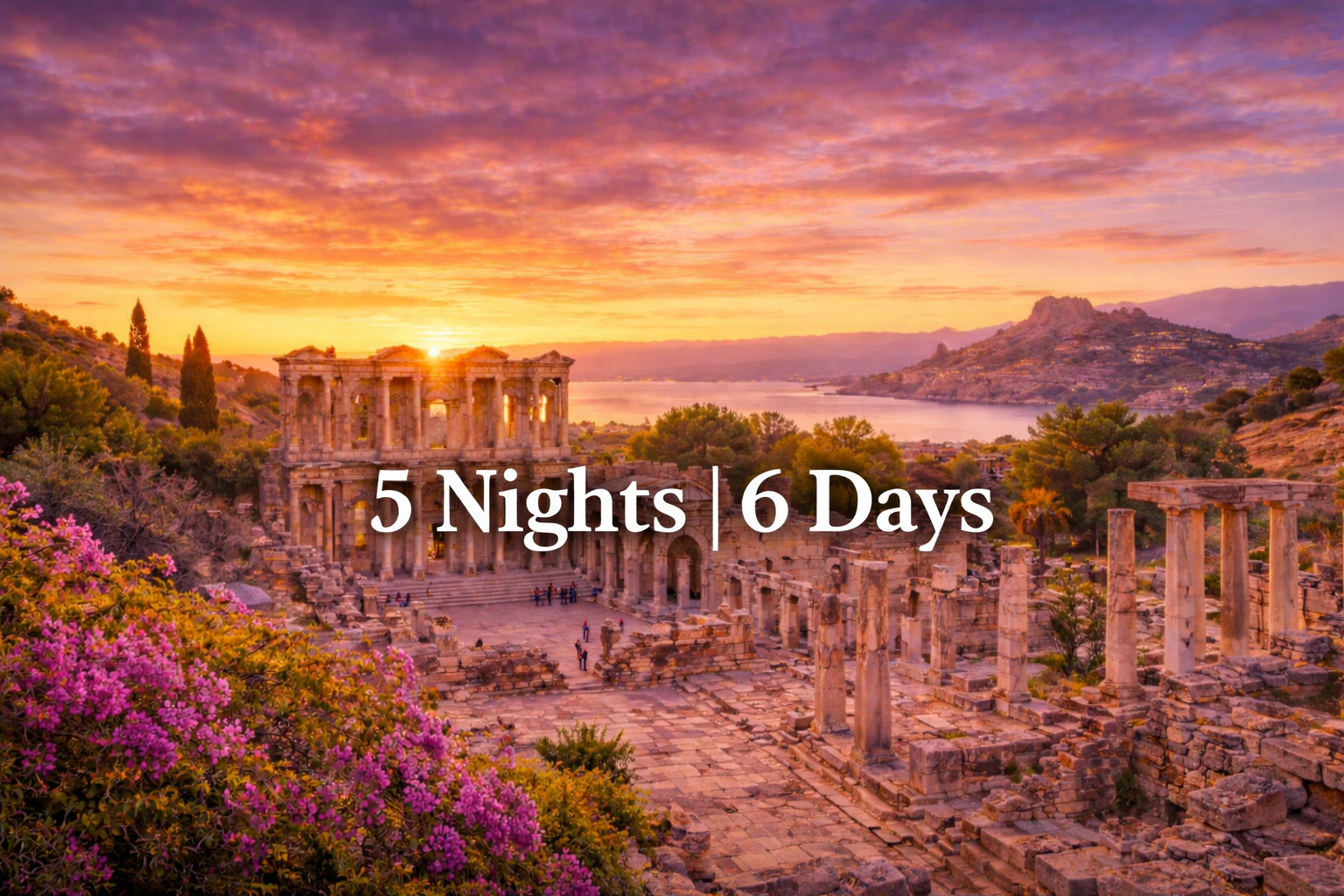 Sunset view of ancient ruins, sea, and colorful sky.