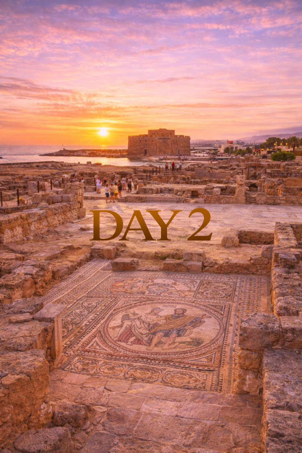 Ruins of a historical site with a mosaic floor and a castle, silhouetted against a sunset, 