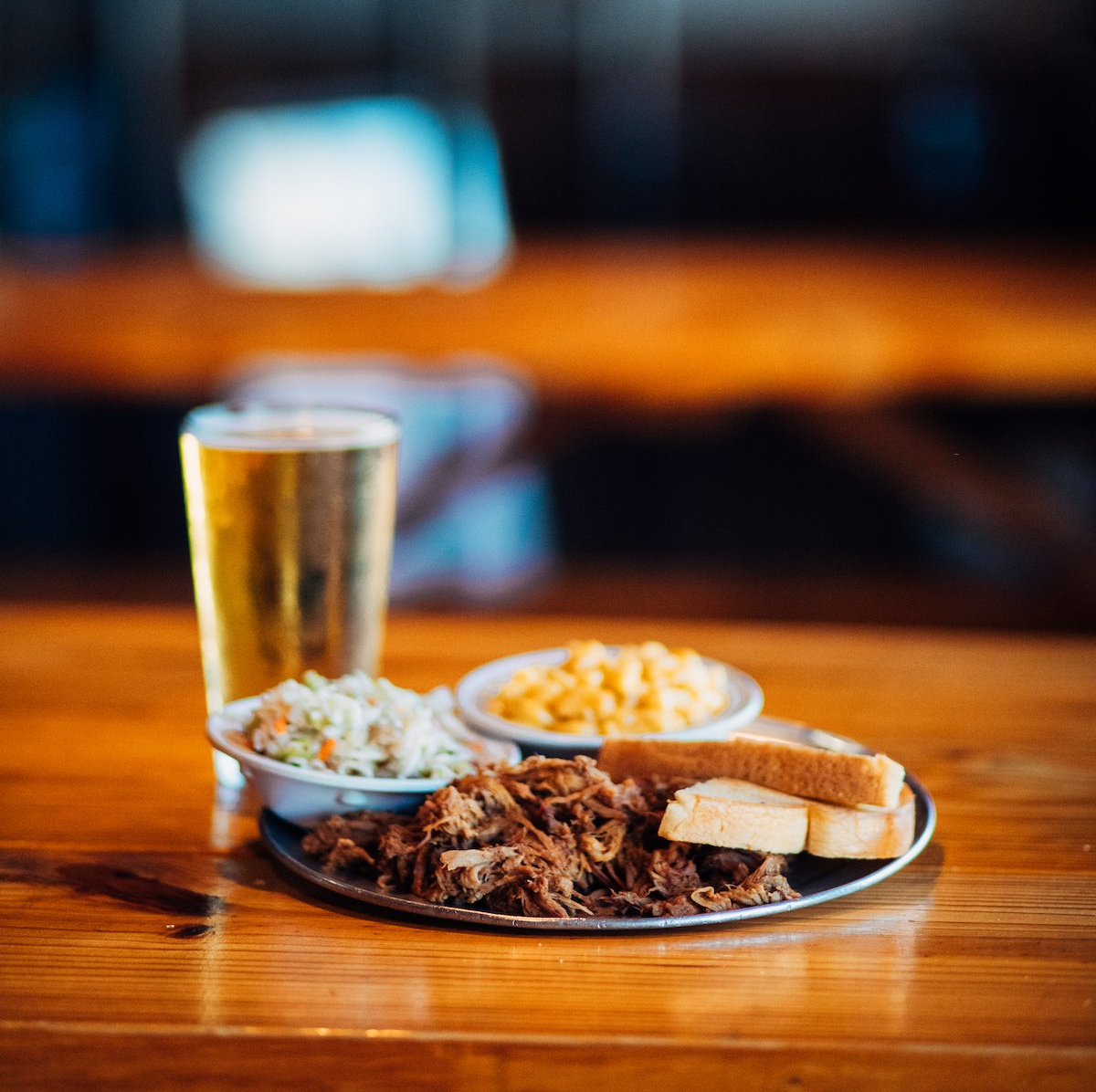 Try a Delicious Plate of Barbecue With Southern Sides and a Cold Beer at Como Smoke & Fire.
