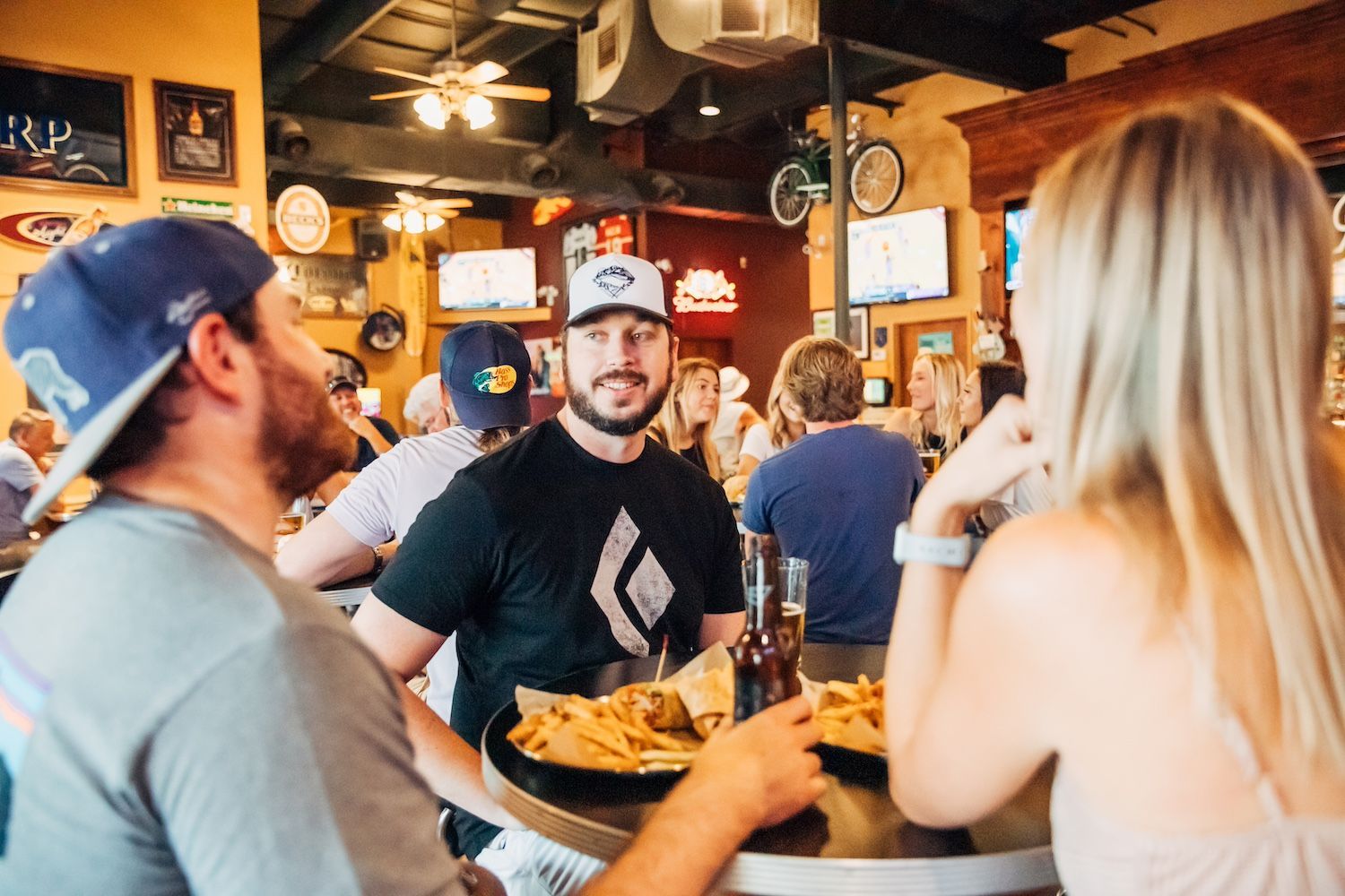 A Group of Young Adults Watch Professional & College Sports at The Deuce Pub & Pit in Columbia, MO.