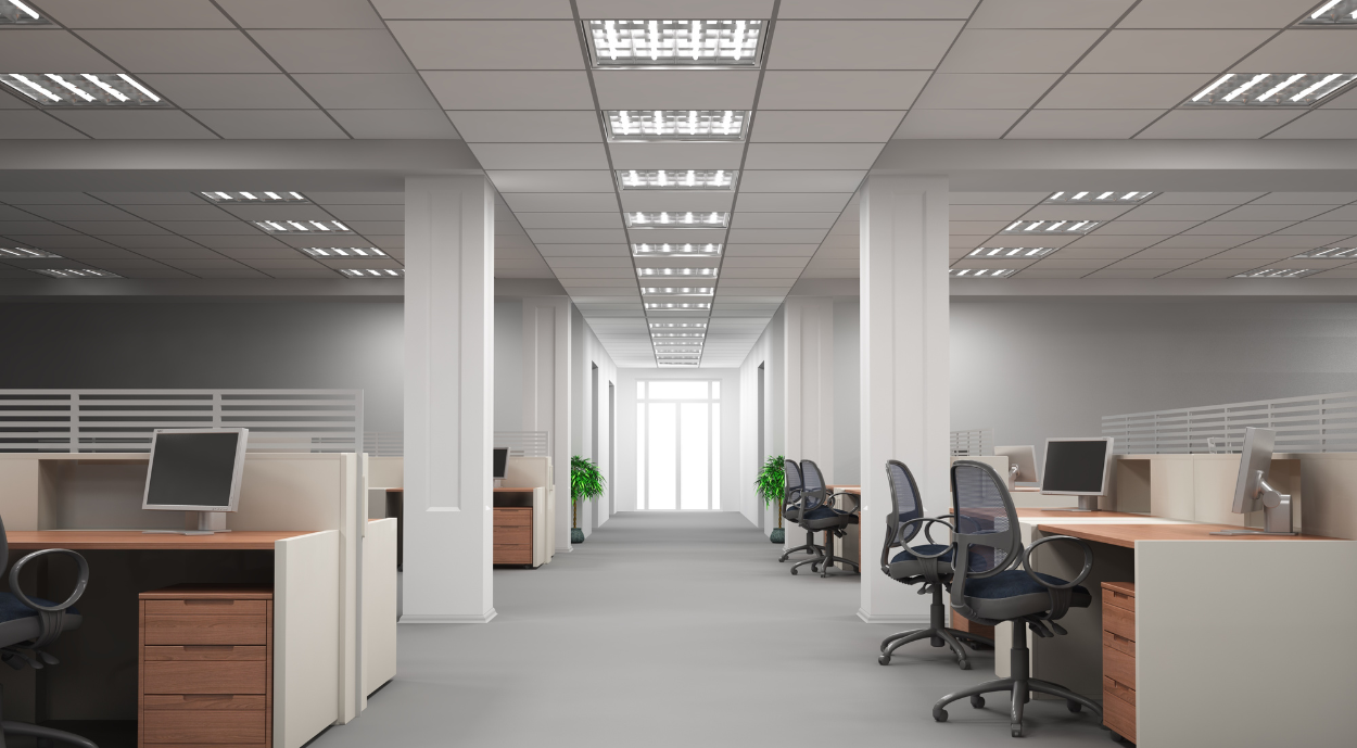 A laptop computer is sitting on top of a wooden table.