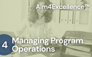 A woman sitting at a desk with the words