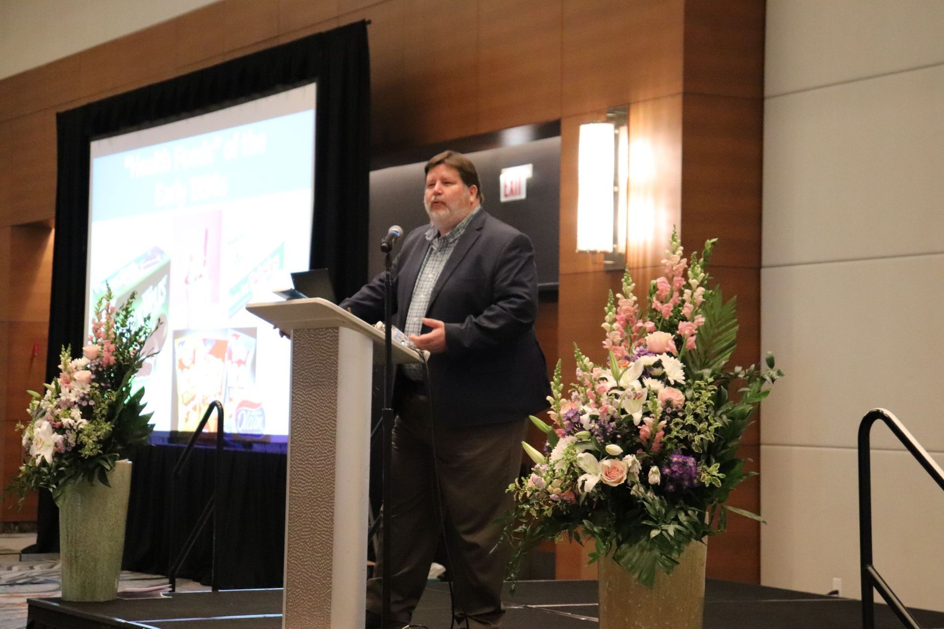 A man is standing at a podium giving a speech.