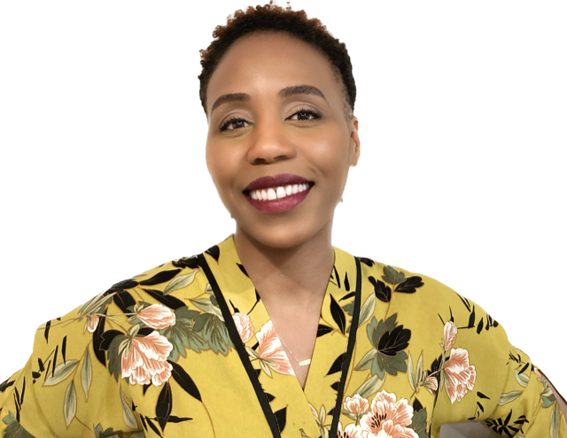 A smiling person wearing a mustard yellow floral print top against a plain white background.