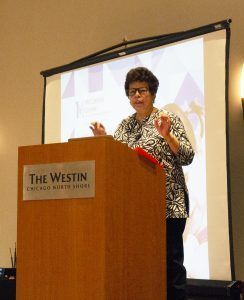 Aisha Ray at a podium