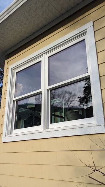 A close up of a window on the side of a house.