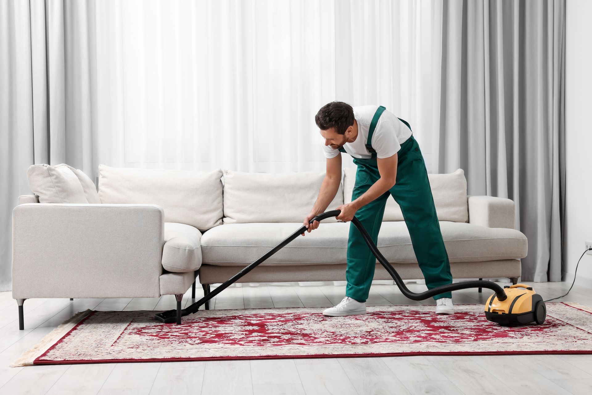 Man Cleaning The Carpet — Central Falls, RI — Fogo Janitorial
