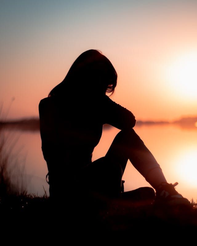 a woman experiencing grief from a loss  