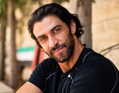 A headshot of Milad looking at the camera