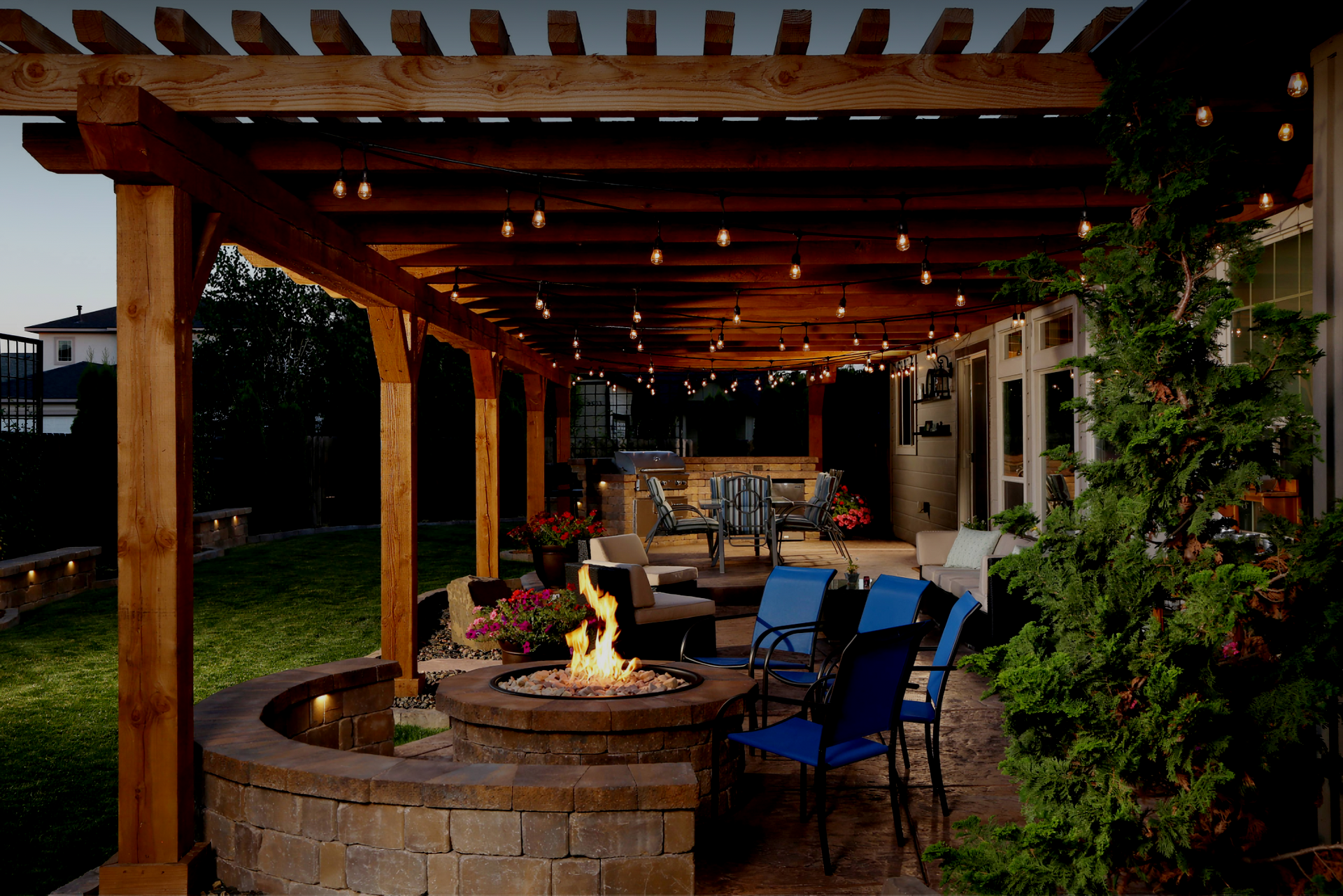 A wooden gazebo sits next to a swimming pool