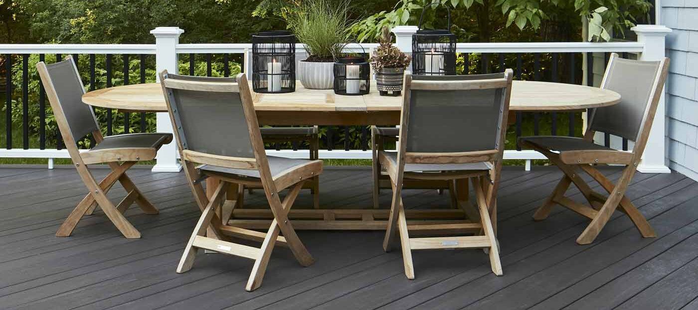 There is a table and chairs on the deck.