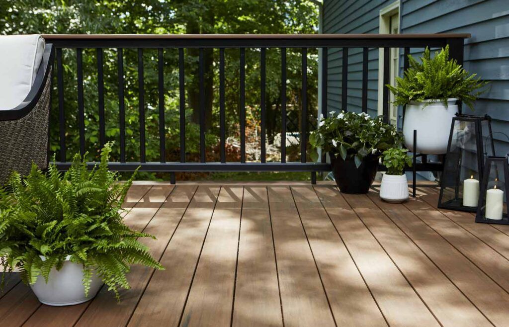 A house with a large deck and stairs leading up to it.