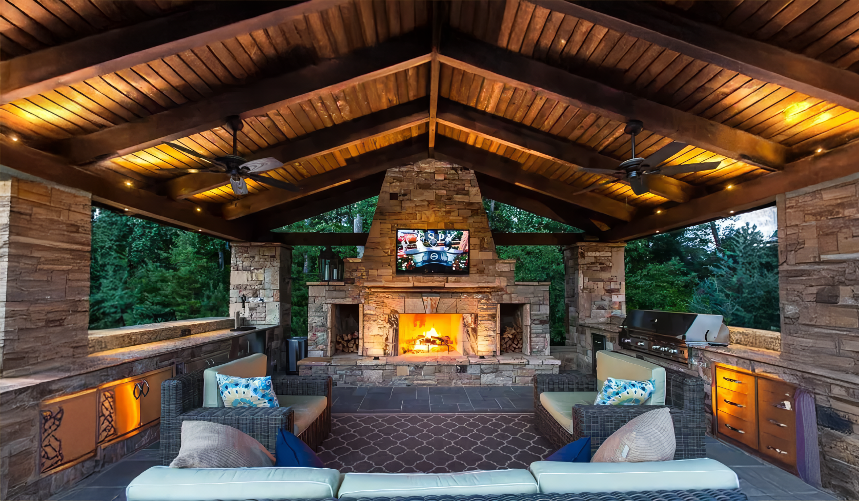 A living room with a fireplace and a flat screen tv.