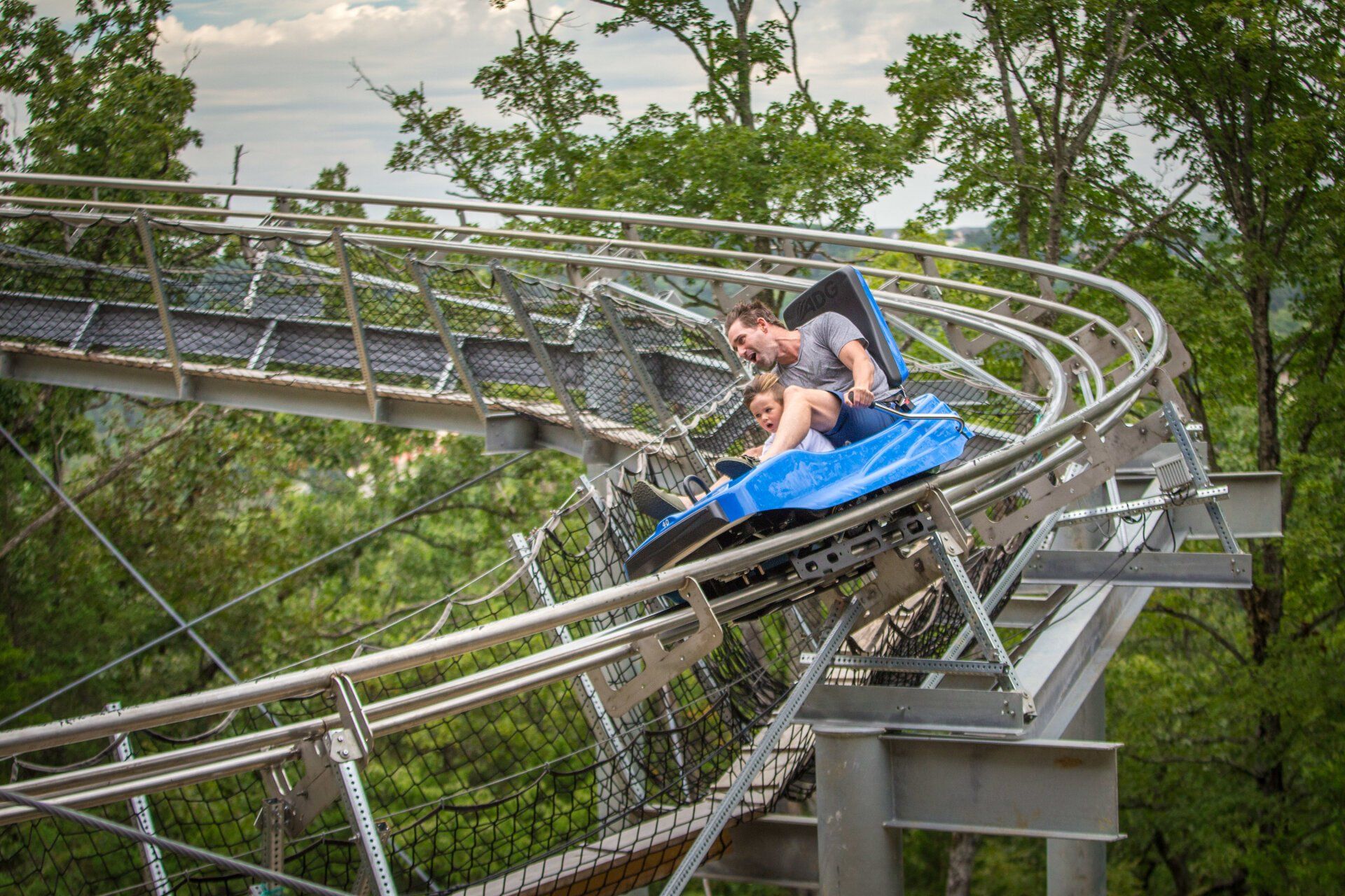Man riding in coaster sideaway