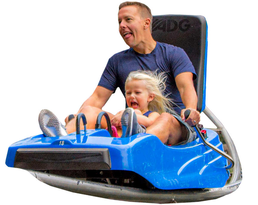 Father and daughter enjoying riding in a Branson coaster